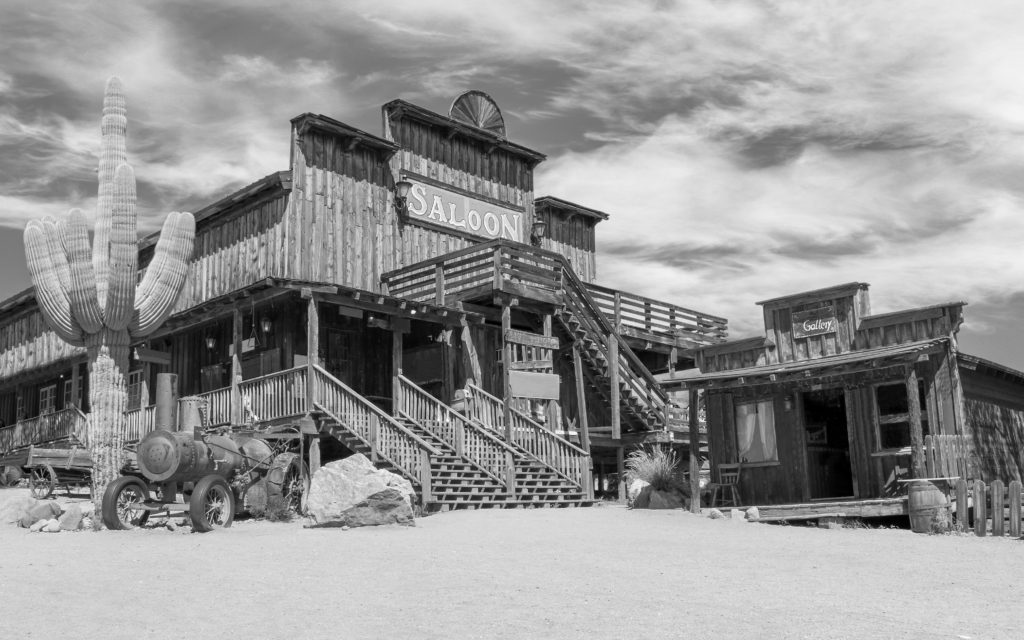 Old Wild West Desert Cowboy Town With Cactus And Saloon In Black And White